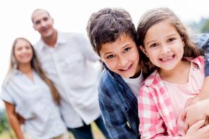 Two happy children in Las Vegas who are being supported well by their parents.