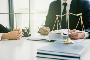 A lawyer in Henderson reviewing a divorce case with his client.
